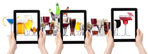 Alcohol drinks set and tablet pc with hand — Stock Photo, Image