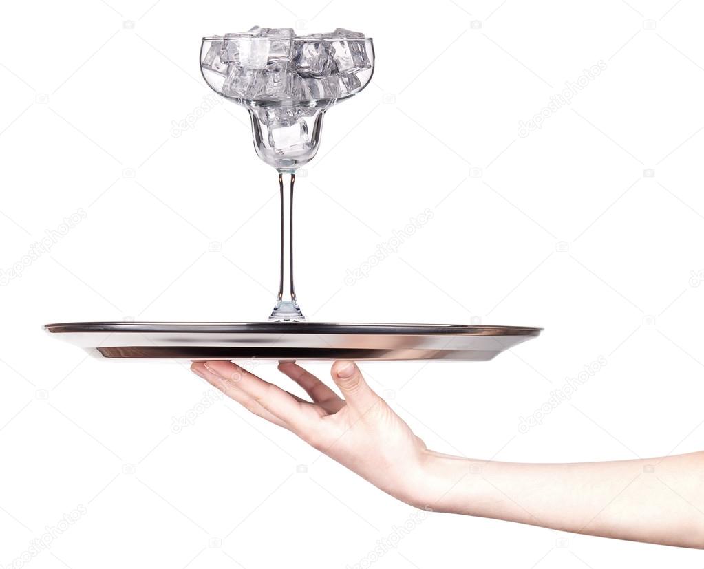 full of ice cocktail glass on a tray with