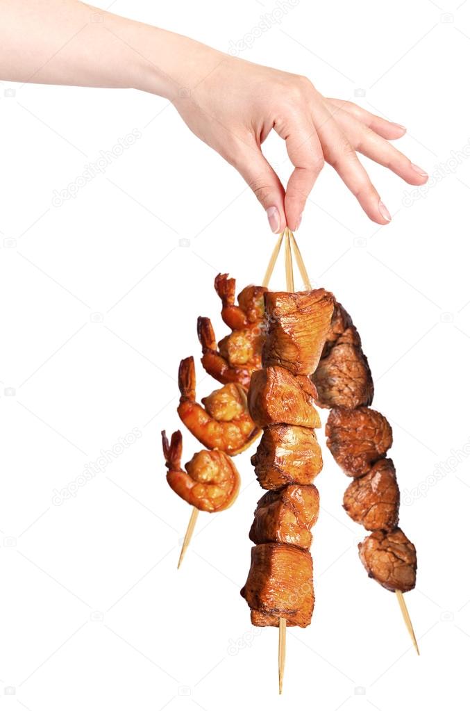 fresh grilled meat dishes with hand