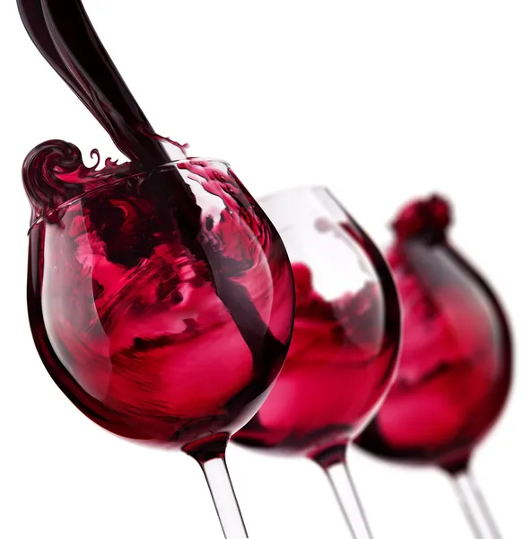 Tres copas con salpicadura de vino tinto — Foto de Stock