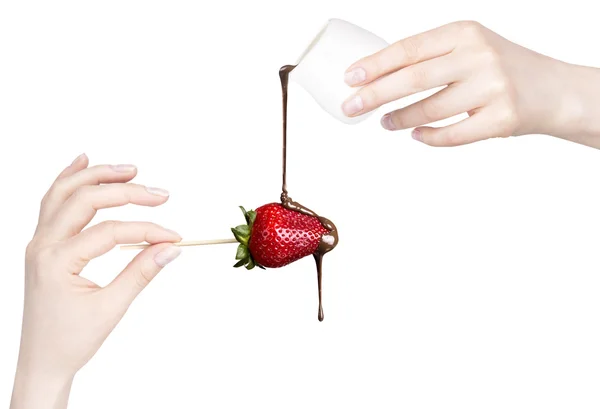 Strawberries and chocolate with hand — Stock Photo, Image