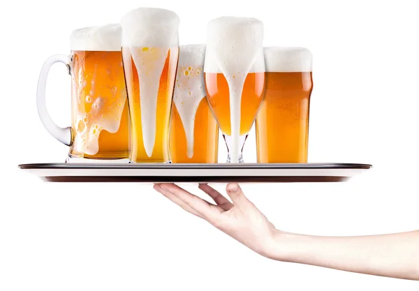 Beer on a silver tray with waitress hand — Stock Photo, Image