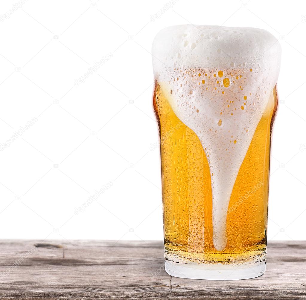 Frosty glass of light beer isolated