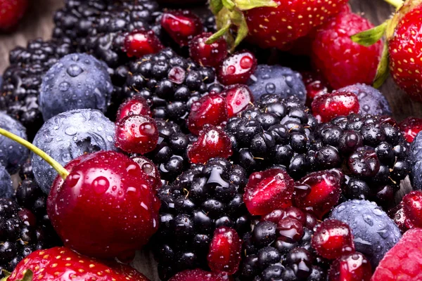 Tasty summer fruits on a wooden table — Stock Photo, Image