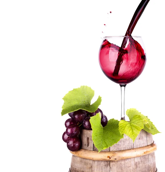 Grapes and wine glass on a wooden vintage barrel — Stock Photo, Image