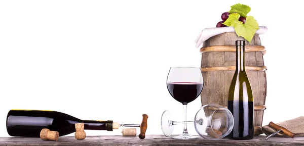 Grapes on a barrel with corkscrew and wine glass — Stock Photo, Image