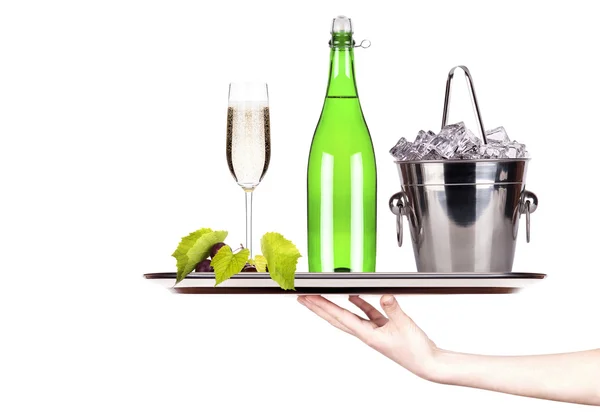 Grapes, ice bucket with champagne on a tray — Stock Photo, Image