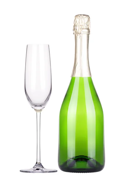 Leeg glas en fles champagne geïsoleerd — Stockfoto