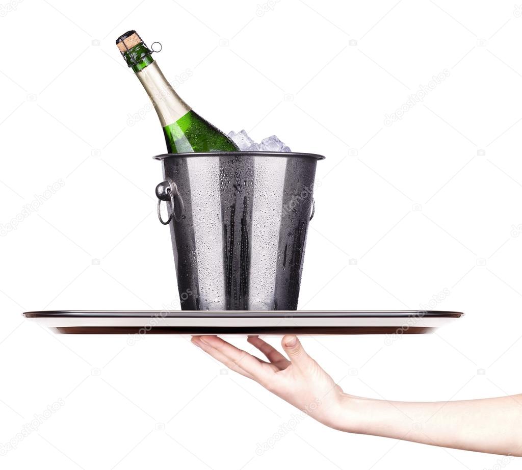 Bottle of champagne in ice bucket on a tray