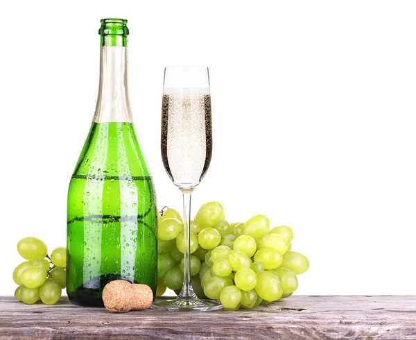Uva con bottiglia di champagne e bicchiere — Foto Stock