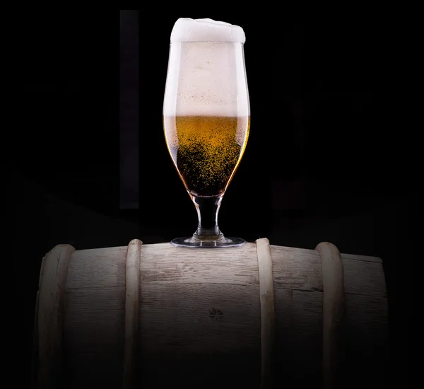 Frosty glass of light beer on black background — Stock Photo, Image