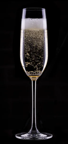 Glass of champagne isolated on black background — Stock Photo, Image