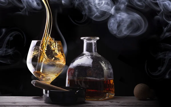 Cognac glass shrouded in a smoke — Stock Photo, Image