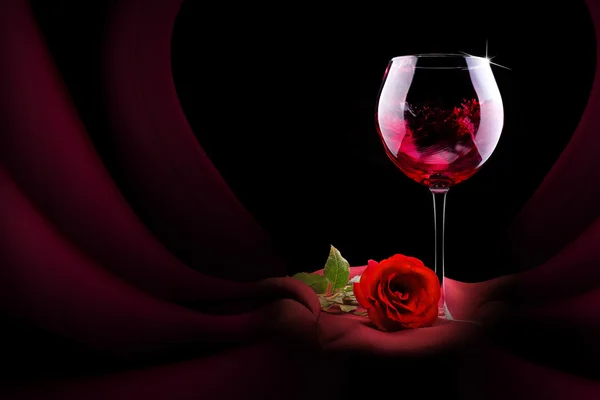 Glass of wine with red silk and flower — Stock Photo, Image