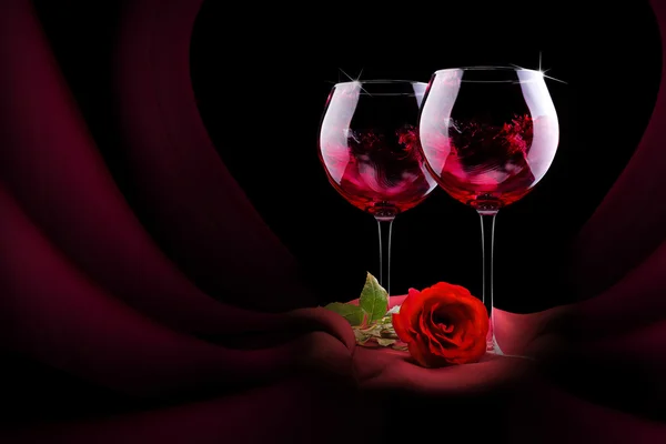 Glass of wine with red silk and flower — Stock Photo, Image