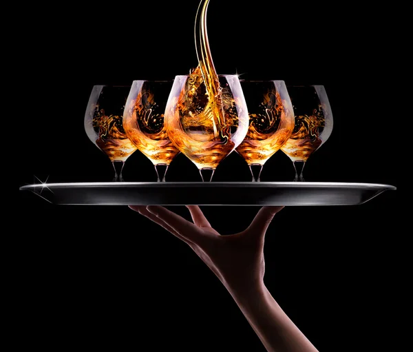 Cognac oder Brandy auf einem schwarzen — Stockfoto