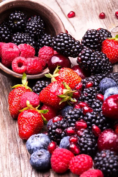 Tasty summer fruits on a wooden table — Stock Photo, Image