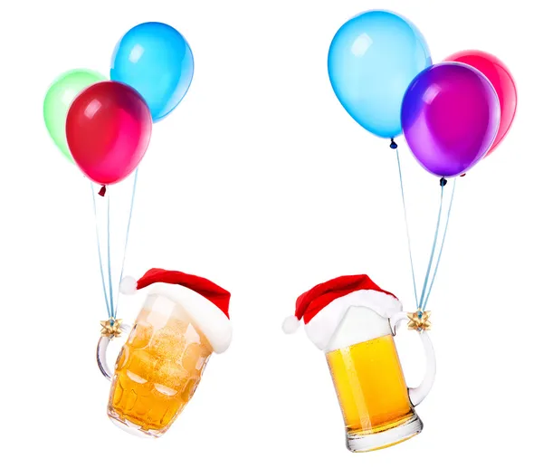 Beer with hat of Santa and balloons — Stock Photo, Image
