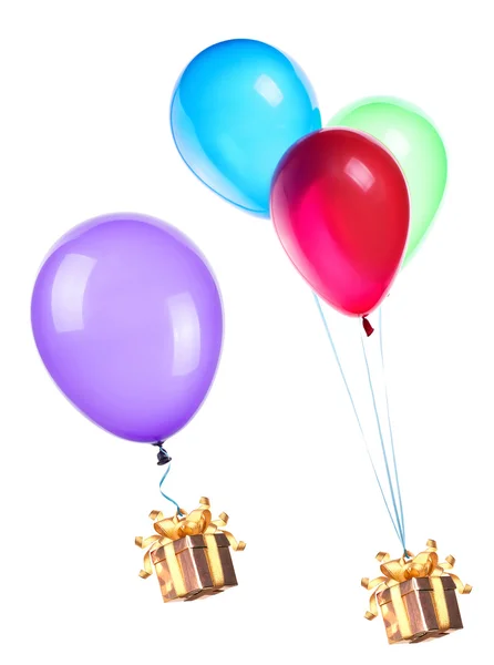 Gift hanging on color balloons — Stock Photo, Image