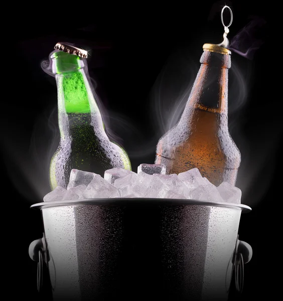 Beer bottles in ice bucket — Stock Photo, Image