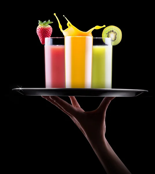 Tasty summer fruit drinks with splash on tray — Stock Photo, Image