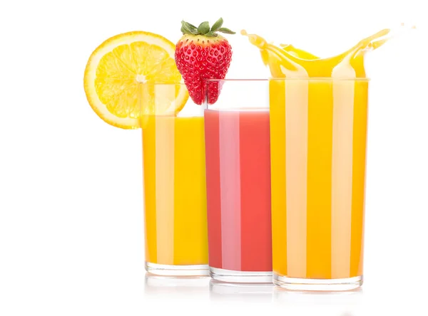 Tasty summer fruit drinks in glass with splash — Stock Photo, Image