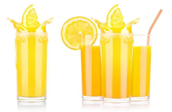 Färsk apelsinjuice i glas med färgstänk — Stockfoto