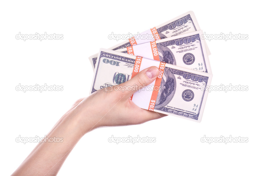 Big packs of dollars in hand isolated on a white background