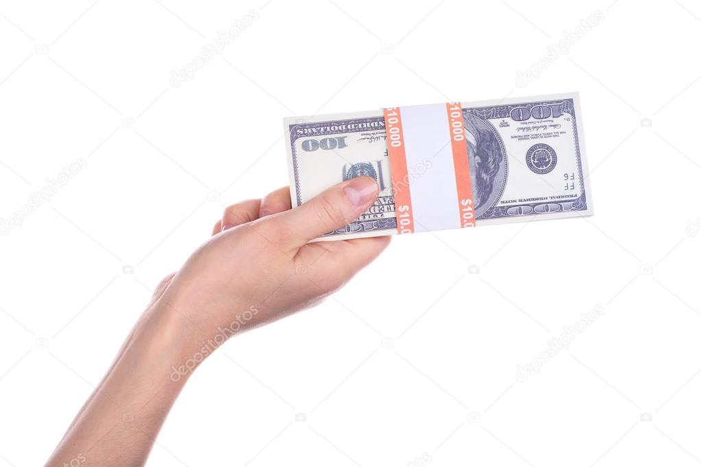 Big packs of dollars in hand isolated on a white background