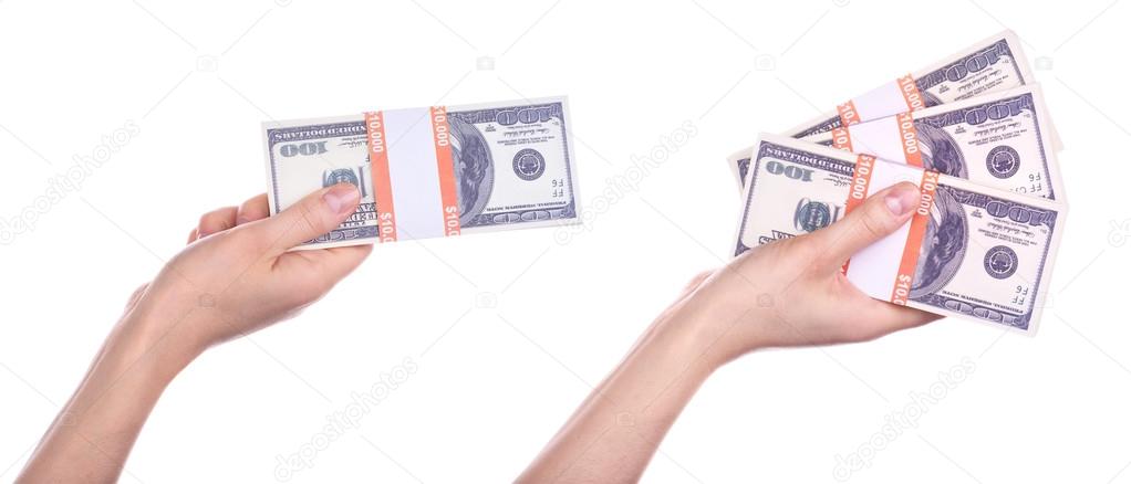 Big packs of dollars in hand isolated
