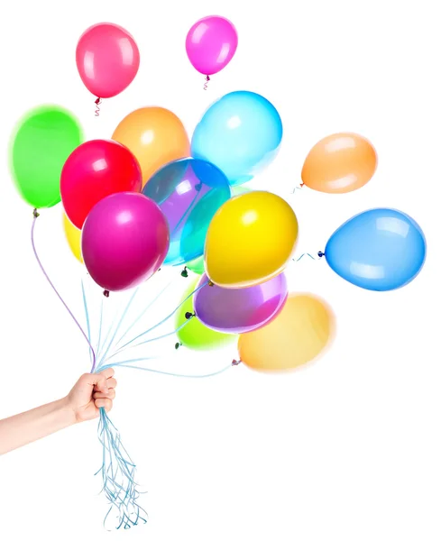 Human hand gives flying balloons — Stock Photo, Image