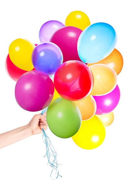 Menselijke hand geeft vliegende ballons — Stockfoto