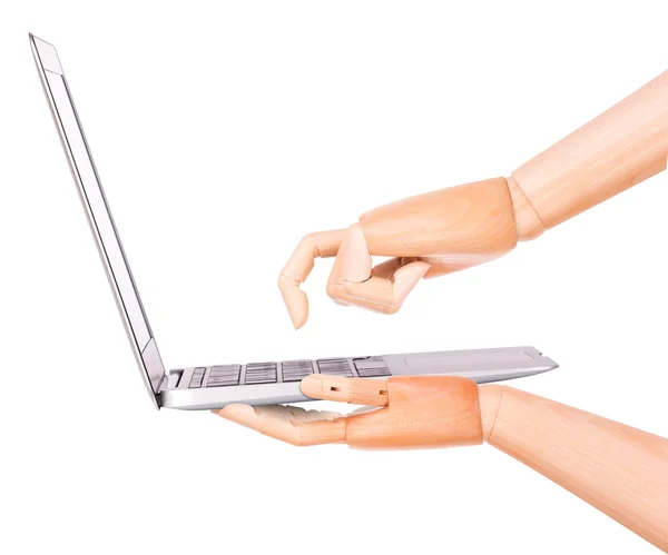 Laptop with wooden hand isolated — Stock Photo, Image