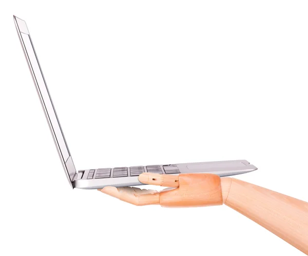 Laptop with wooden hand isolated — Stock Photo, Image