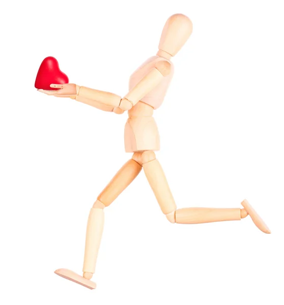 Wooden Dummy holding red heart — Stock Photo, Image