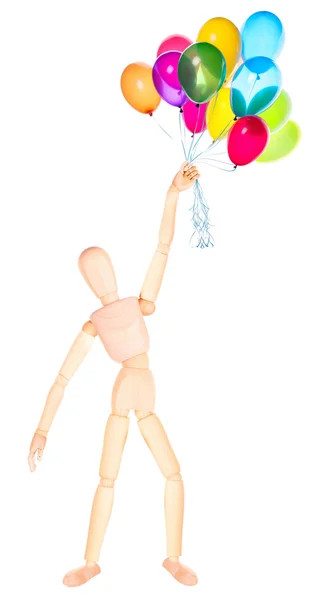 Wooden Dummy holding flying balloons isolated — Stock Photo, Image