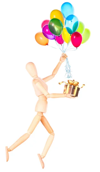 Uçan balonlar ve hediye tutarak tahta kukla — Stok fotoğraf