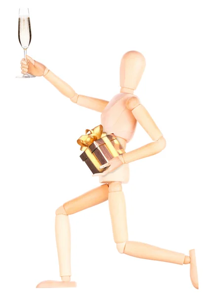 Wooden Dummy with champagne holding gift — Stock Photo, Image