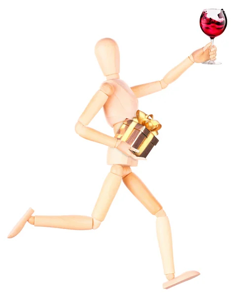 Wooden Dummy with wine holding gift — Stock Photo, Image