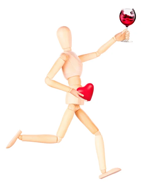 Wooden Dummy with champagne holding red heart — Stock Photo, Image