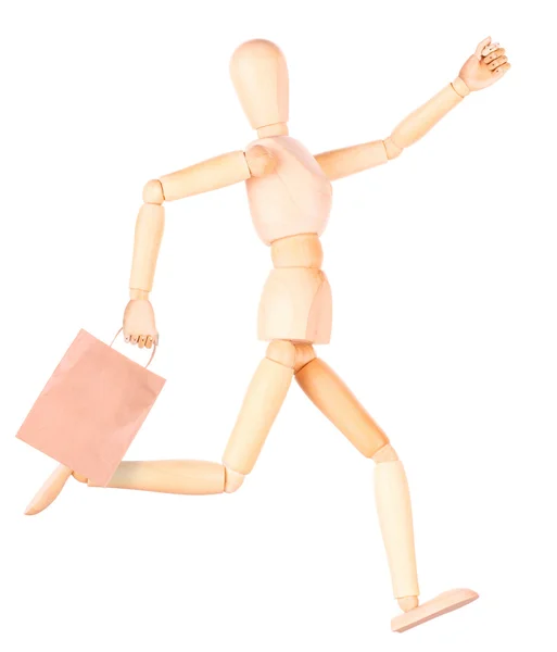 Happy wooden Dummy with shopping bags — Stock Photo, Image