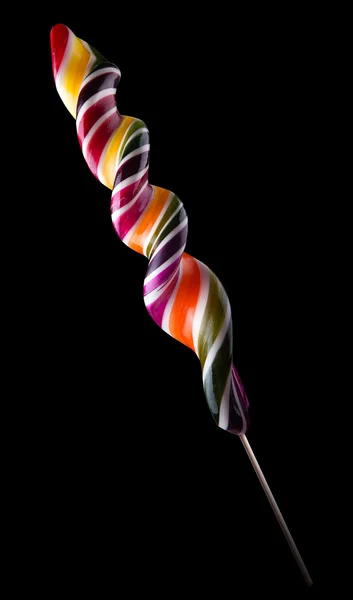 Lollipop colorido brillante sobre fondo negro — Foto de Stock