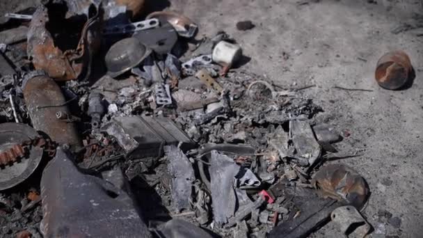 Spare parts from destroyed tanks and cars. Many metaexcerpts due to Russians bombing of Ukrainian cities. — Video