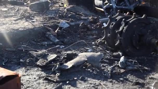 Spare parts from destroyed tanks and cars. Many metaexcerpts due to Russians bombing of Ukrainian cities. — Video