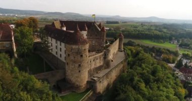 Travelling copter around the famous historic Stettenfels Castle surrounded by greeny vineyards in Weinsberg, Heilbronn district, Germany