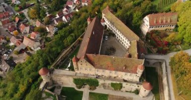 Old historic Stettenfels Castle surrounded by green blooming vineyards at the background of Weinsberg panorama in Heilbronn district, Germany
