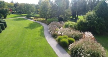 Close-up view from copter of the charming colourful blooming Wertwiesenpark in Heilbronn, Germany. 4k footage