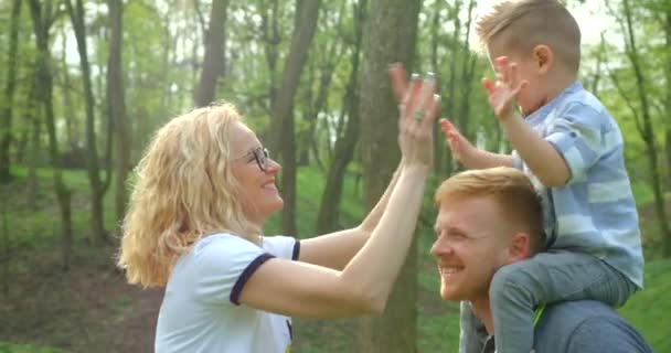 Happy Beautiful Mother Clapping Hands Her Little Smiling Son Forest — Stock Video