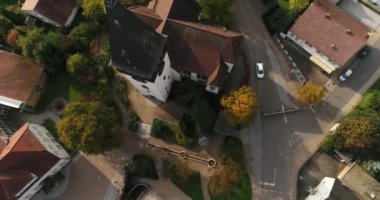 Weinsberg in Heilbronn district in Germany. Moving copter up. Close-up view of the rural houses