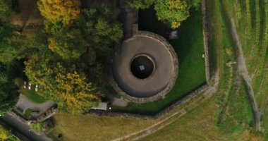 Beautiful vineyard in Burgruine Weibertreu in Weinsberg, Heilbronn district in Germany. Circling copter is moving up. Top view. 4k footage